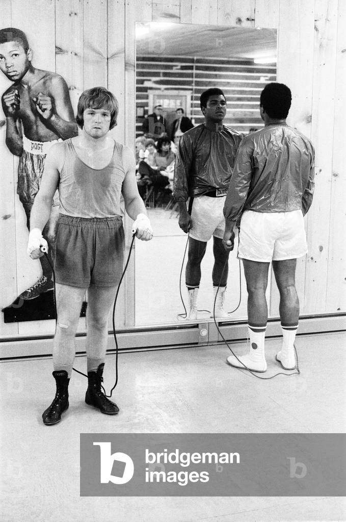 Boxers Muhammad Ali and Bob Foster in the gym. January 1973 (b/w photo)