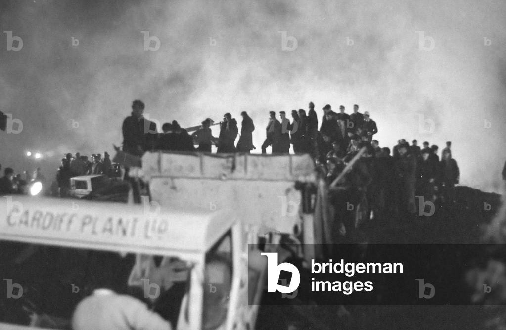 Rescue workers continue the search for victims engulfed when a slag heap collapsed at Aberfan, South Wales, 21st October 1966 (b/w photo)