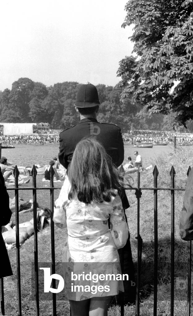 Policeman and young girl at The Rolling Stones concert at Hyde Park, 5th July 1969 (b/w photo)