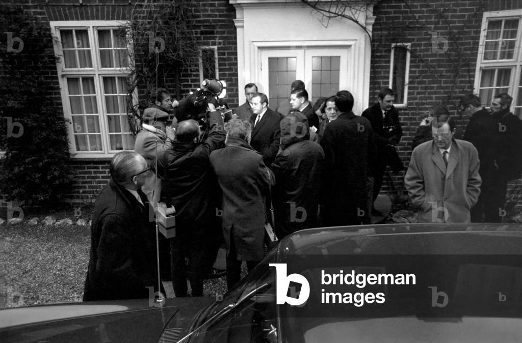 Scotland Yard today started a massive hunt for Mrs. Muriel McKay wife of Mr. Alex McKay a director of the News of the World. She vanished from her home in Arthur Road, Wimbledon (Monday night). There were signs of a forced entry. Today police combed Wimbledon Common and were led by Chief Supt. William Smith who was in charge of the case, and Det. Insp. Johnny Mynors. On left is Chief Supt. William Smith and behind him Det. Insp. Johnny Mynors outside the house tonight. December 1969