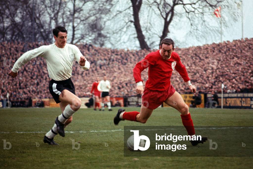Bobby Robson of Fulham in a race for the ball with Ian St John of Liverpool during the two team's league matchat Craven Cottage. 25th February 1967 (photo)