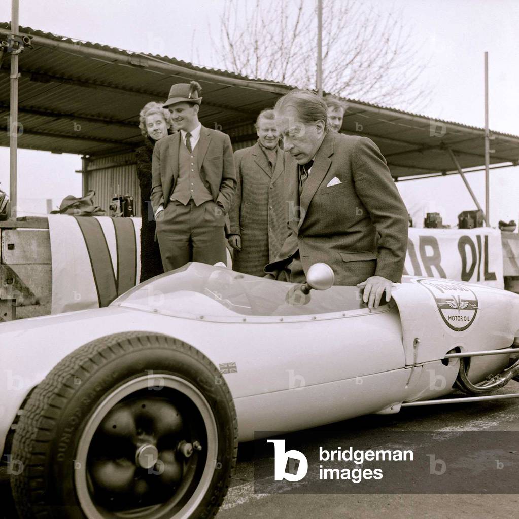 John Paul Getty oil Baron trying out a racing car A Lotis Junior Formula at the Goodwood race track, February 1962 (b/w photo)