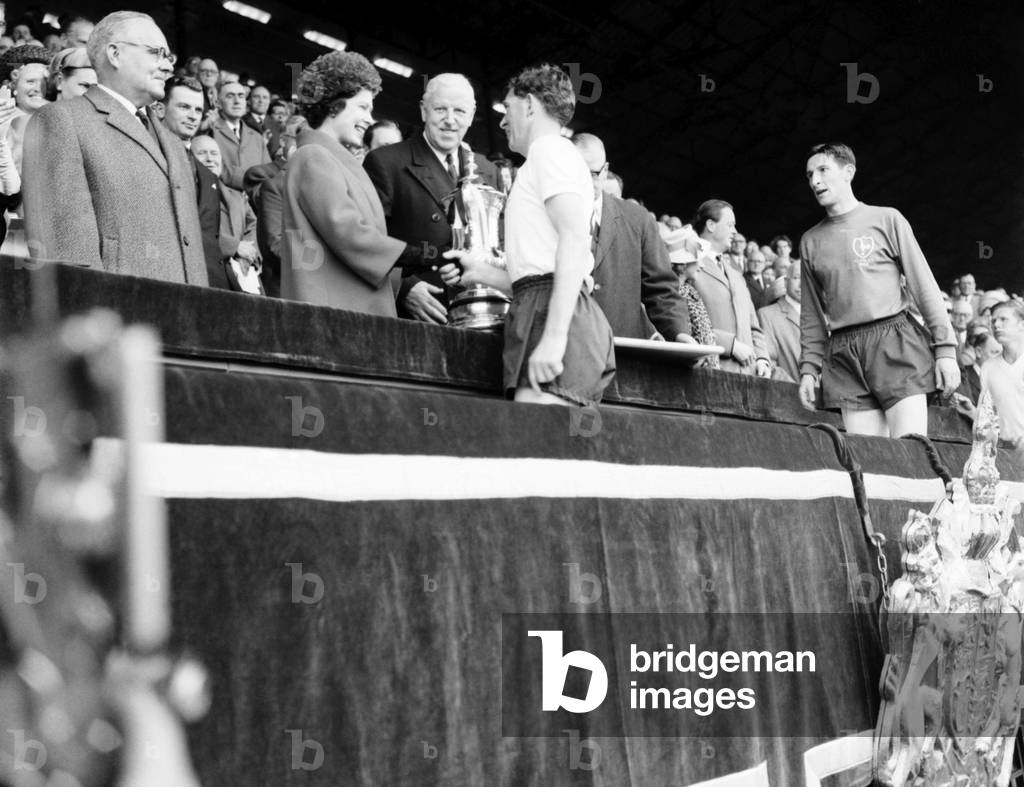 FA Cup final at Wembley Stadium. Tottenham Hotspur 3 v. Burnley 1. Spurs captain Danny Blanchflower receives the trophy from Her Majesty Queen Elizabeth IIMay 1962 Q3891A-004 (photo)