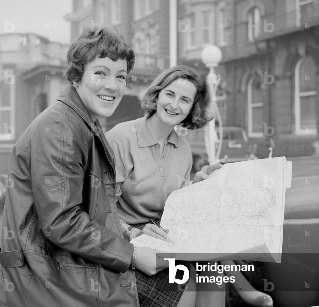 Racing driver Pat Moss (left) and her navigator Ann Wisdom, study their map in Blackpool prior to the latest RAC rally race in the Ladies European Championships.
23rd November 1960