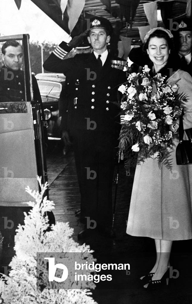 Queen Elizabeth II leaves Monkseaton Station at the start of her tour of Sunderland, 29/10/1954 (b/w photo)