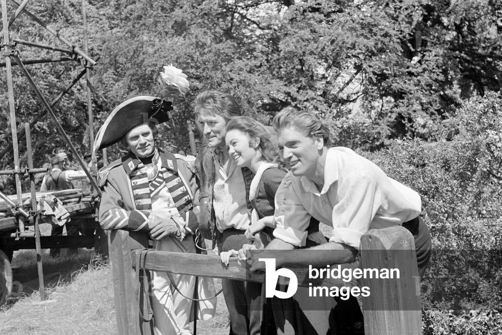 Burt Lancaster with Janette Scott and other actor colleagues during the filming of The Devils Disciple. July 1958 (b/w photo)