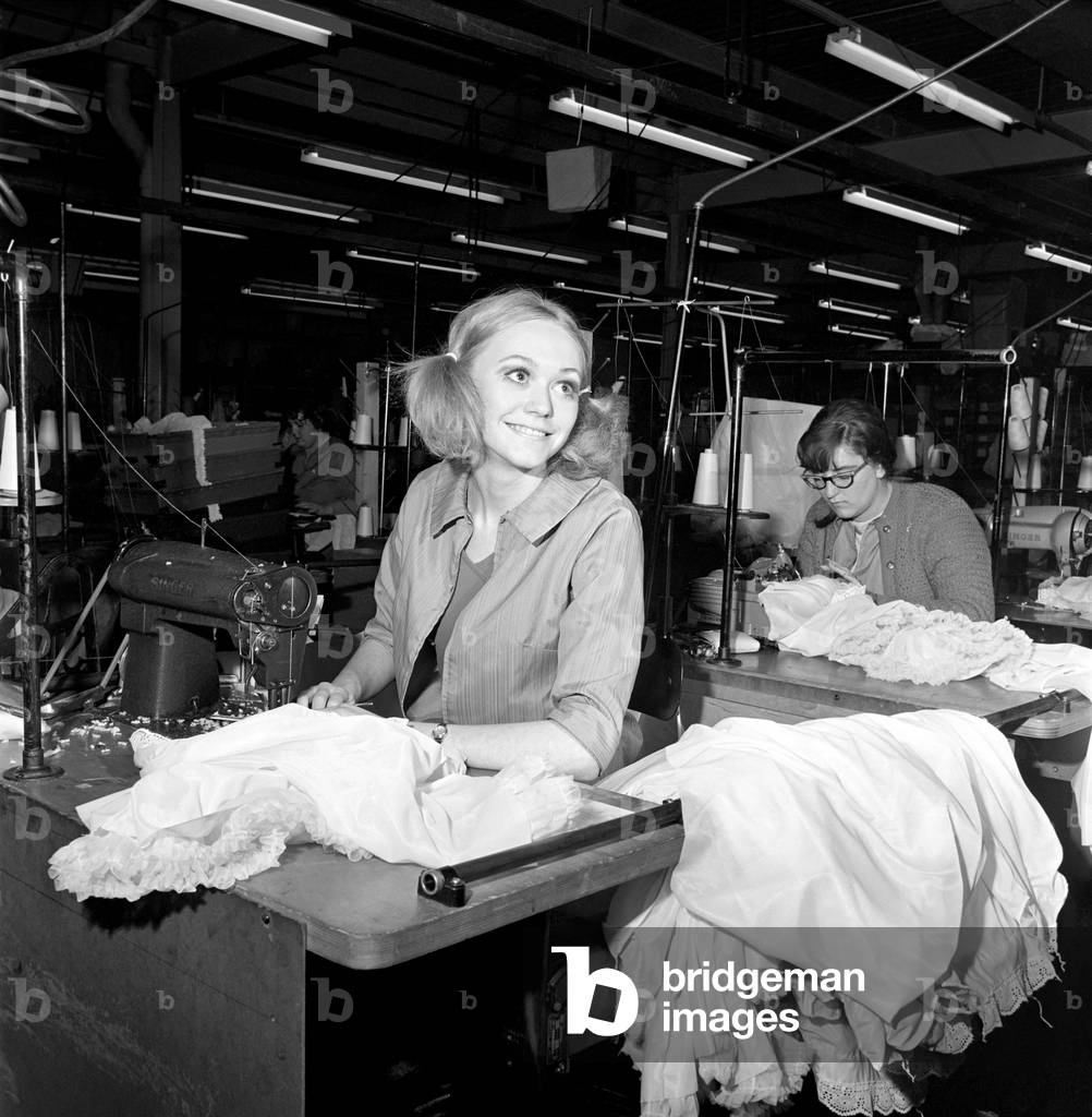 Teenager Penny Vancliff, a factory girl who wants to be a London model. 
Penny at work on her sewing machine at the Blyth factory. 
December 1969