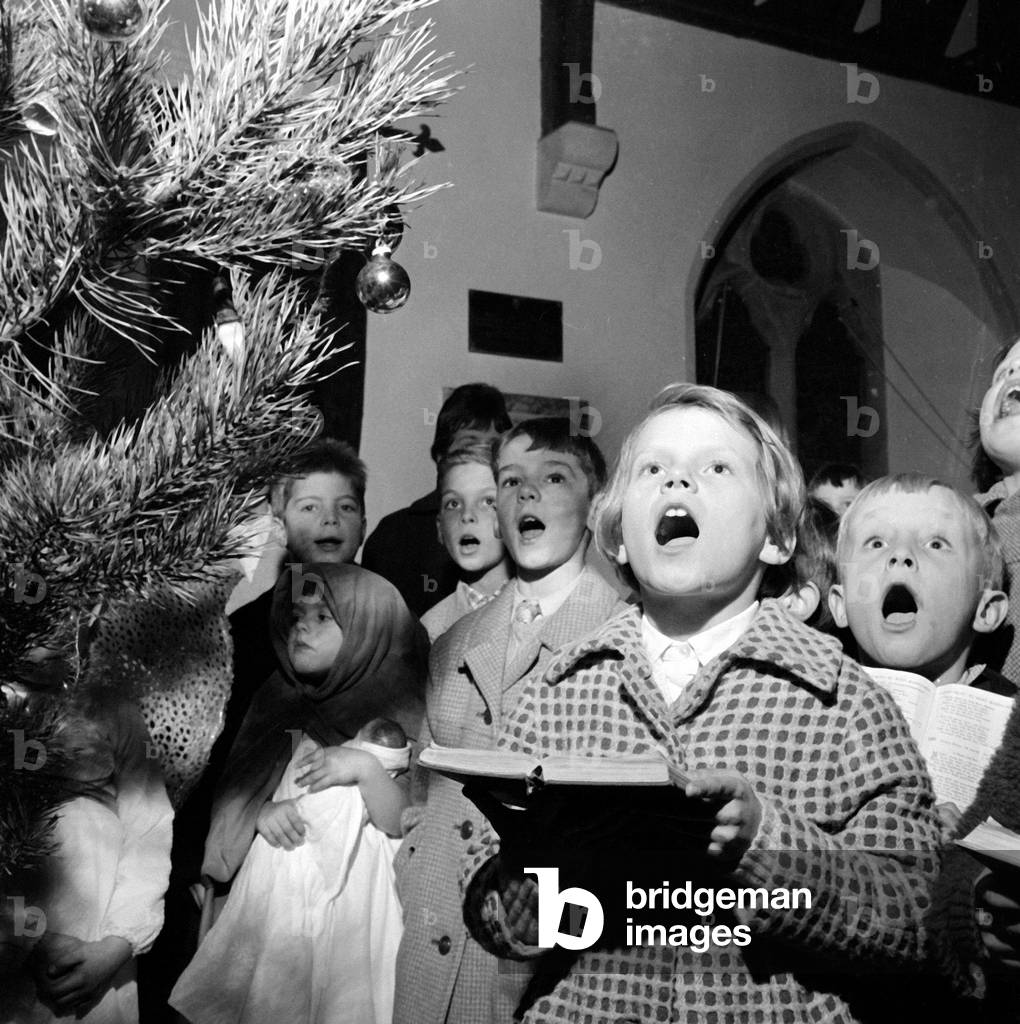 German refugee children sing carols at Christmas time. December 1961