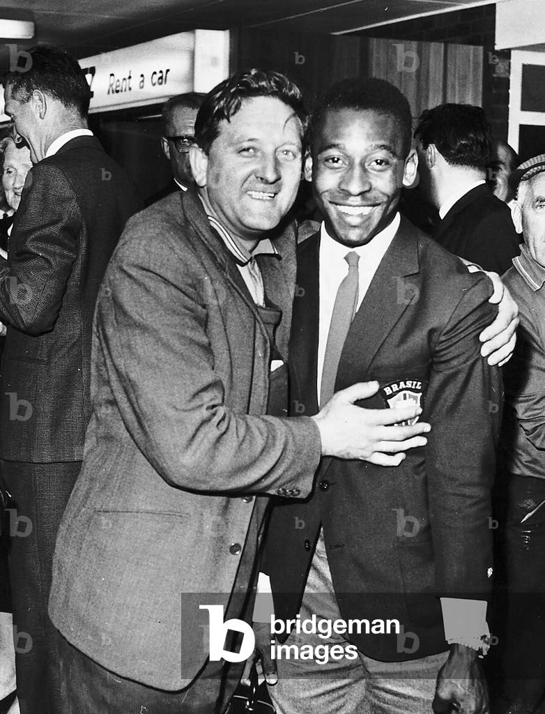 Pele Brazilian football player gets a welcome hug from a fan at Glasgow airport 1966 (photo)