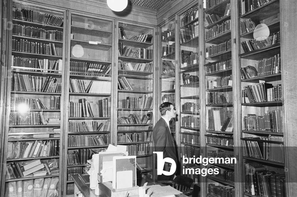 David Rodger, deputy keeper of books at the British Museum looks inside the case containing Britain's collection of dirty books, which have previously never been photographed.
3rd January 1968.