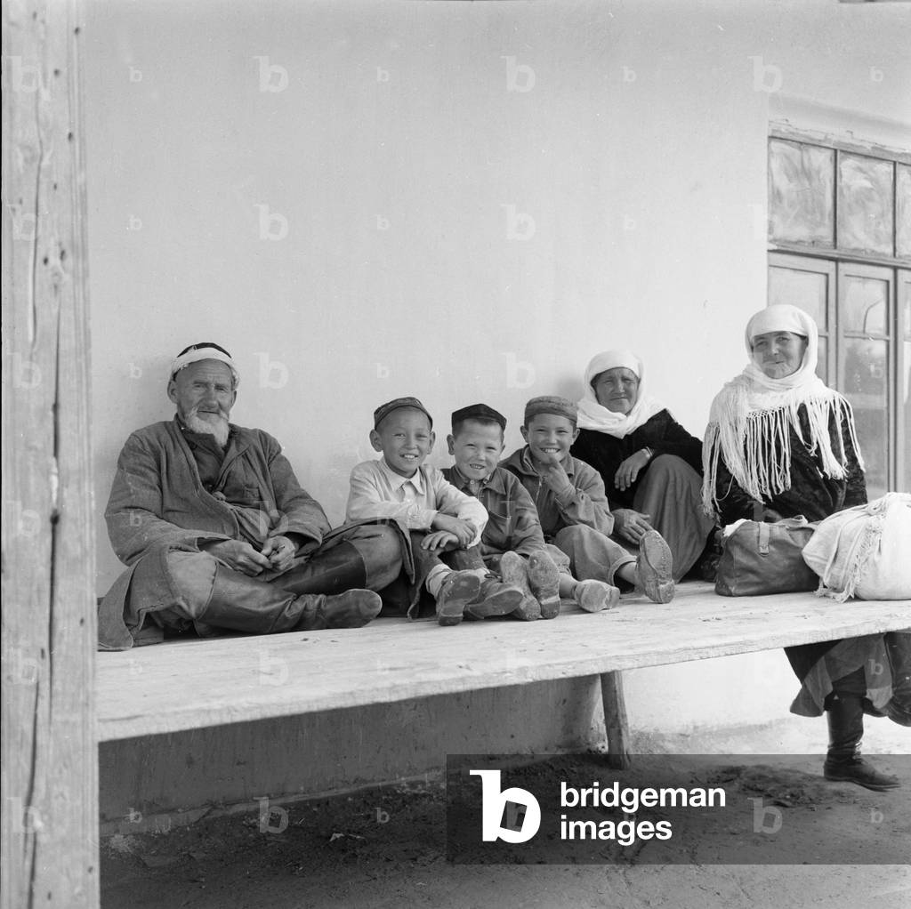 A typical Uzbeki family dressed in traditional costume pose for the Daily Mirror cameraman. May 1960