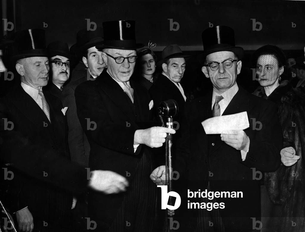 The opening ceremony and consecration of the new ardiff United synagogue at Tygwyn Road. Speaking at the opening ceremony is Mr Harry Sherman (centre) flanked by Mr Abraham Sherman (left) and President of the Synagogue Mr Gershon Cohen (right). January 1955 (b/w photo)
