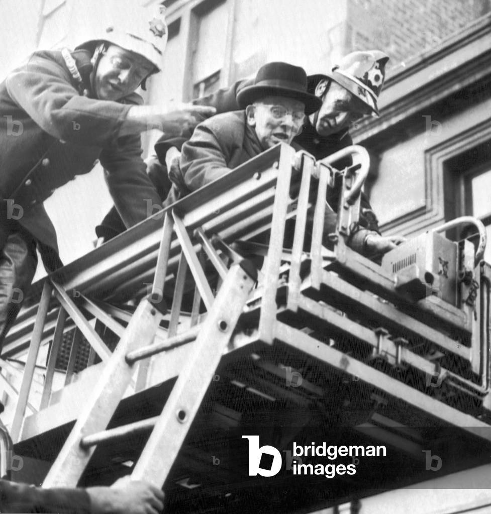 83 year old Frank Hopper seen being rescued from his house in Arlington Street the morning after high winds hit Southern and Central Scotland on the 15th January 1968.