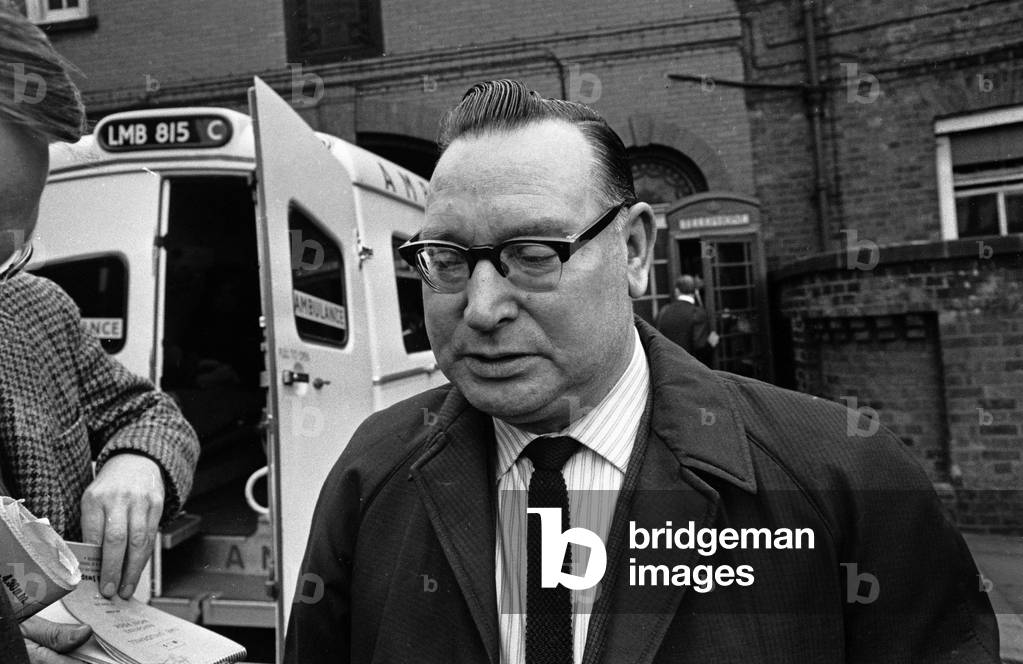 Board of Trade investigators and Rolls Royce experts at work, site of Stockport Air Disaster, the crash of a Canadair C-4 Argonaut aircraft owned by British Midland Airways, registration G-ALHG, near the centre of Stockport, Greater Manchester, England on Sunday 4 June 1967. 72 of the 84 aboard were killed in the accident. Of the 12 survivors, all were seriously injured. Mr Carr of Longsight, a relative of Linda Parry, at hospital, 5th June 1967 (b/w photo)