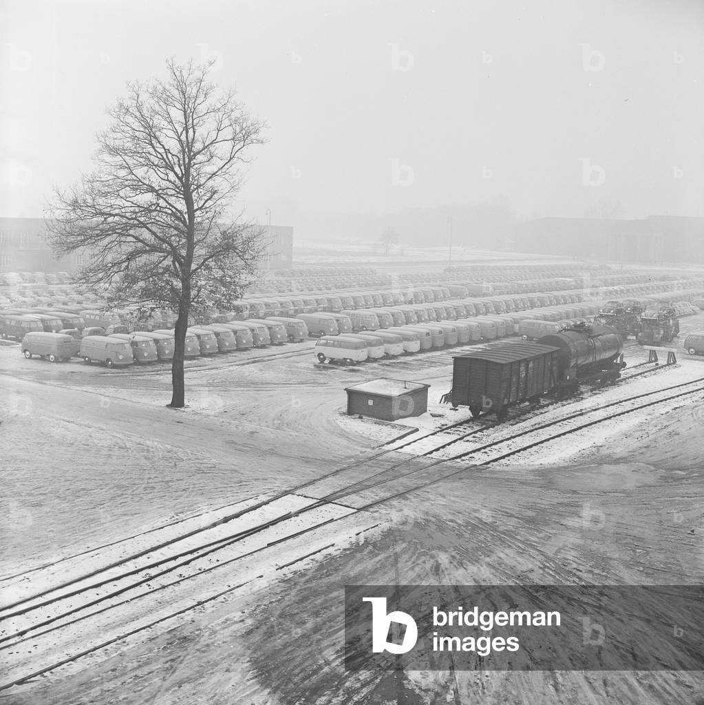 Volkswagen Transporter and Camper vans seen outside the Volkswagen factory at Wolfsburg, Germany. December 1952 (b/w photo)