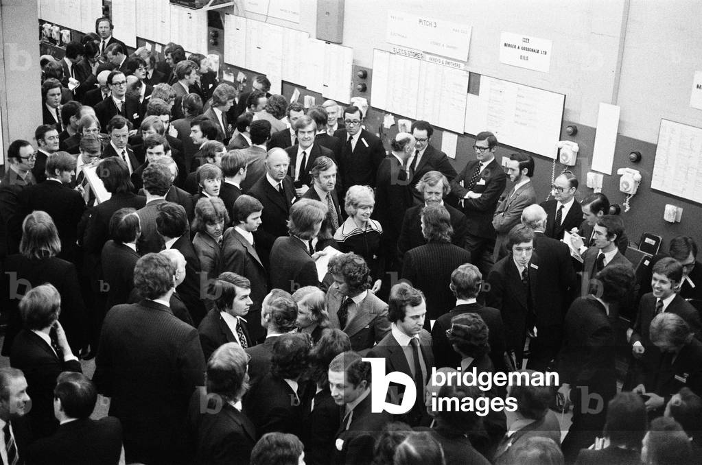 The London Stock Exchange admitted at last about 12 women members. Six of them appeared on the floor amongst the 2,500 men who work there. Their job is mainly in the background and their appearance on the floor was a sort of 'showing the flag'. 26th March 1973 (b/w photo)