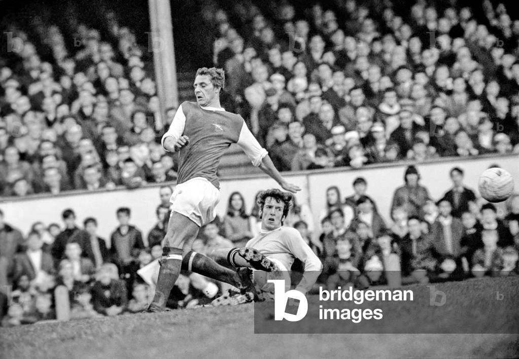 Arsenal v. Manchester City. Booth City centre half beats Arsenal Rodford (left). December 1969 (photo)