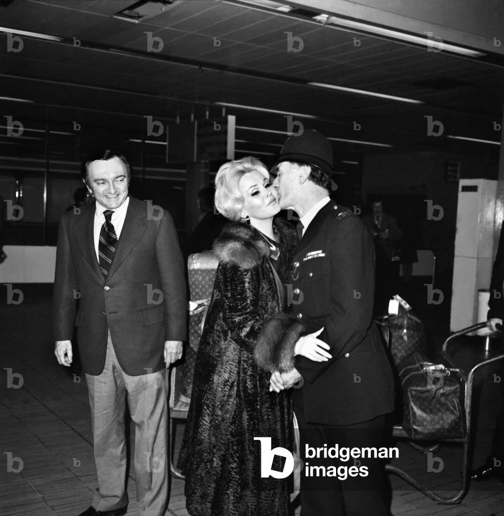 Zsa Zsa Gabor and her new husband inventor Jack Ryan arrived at Heathrow airport from Tokyo, April 1975 (b/w photo)