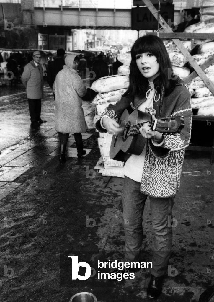 Susie Keeley comes from California, America, she tells that the swinging freedom of busking is its own reward and that she took it up when she could not get a job in London. Now nothing stops her, rain or shine - except policemen. December 1968 P018609