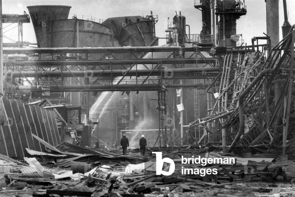 Disaster Blast at Flixborough: A massive blast ripped apart on entire village late on Saturday afternoon, Ist June 1974. At least 29 people died and 100 houses were wrecked when an explosion shook the Nypro chemical plant at the Lincolnshire village of Flixborough. 3,000 people were evacuated as firemen tried to prevent an escape of poisonous gas from ammonia tanks, seven miles away in Scunthorpe flying glass caused injuries and homes shook thirty miles away. The scene of devastation at Nypro works, Flixborough. June 1974