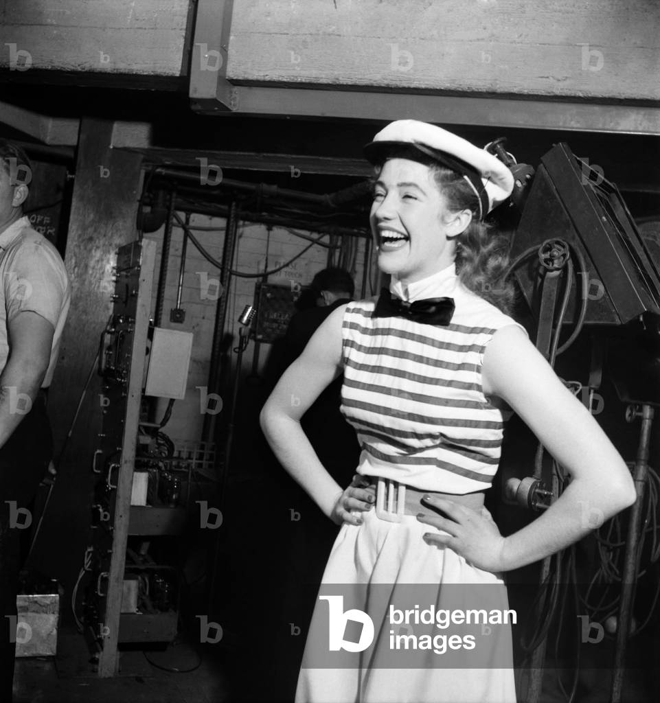 Actress Audrey Freeman wearing striped top, bow tie and sailors hat. 
September 1952 
C4680