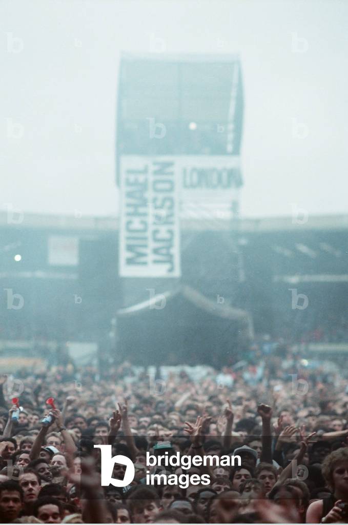 Michael Jackson can be seen performing on stage at Wembley during the Bad concert tour 14th July 1988 Audience gather around the stage where Michael Jackson was performing on stage at Wembley during the Bad concert tour 14th July 1988 (photo)