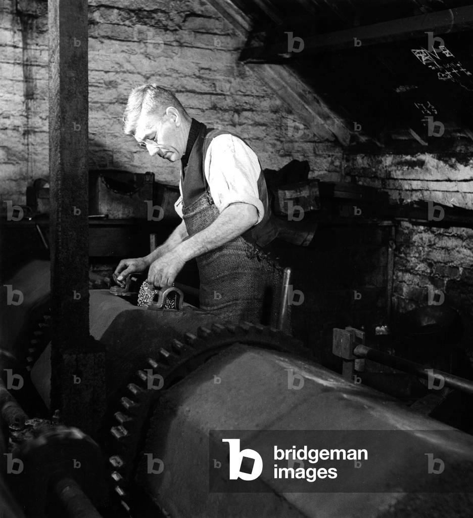 Chain Mail being hardened then polished by hand, 29th April 1948 (b/w photo)