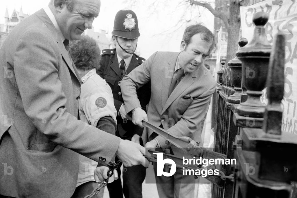 Members of the Women's Liberation Movement chained themselves to the railings at the statue of Sylvia Pankhurst, April 1975 (b/w photo)