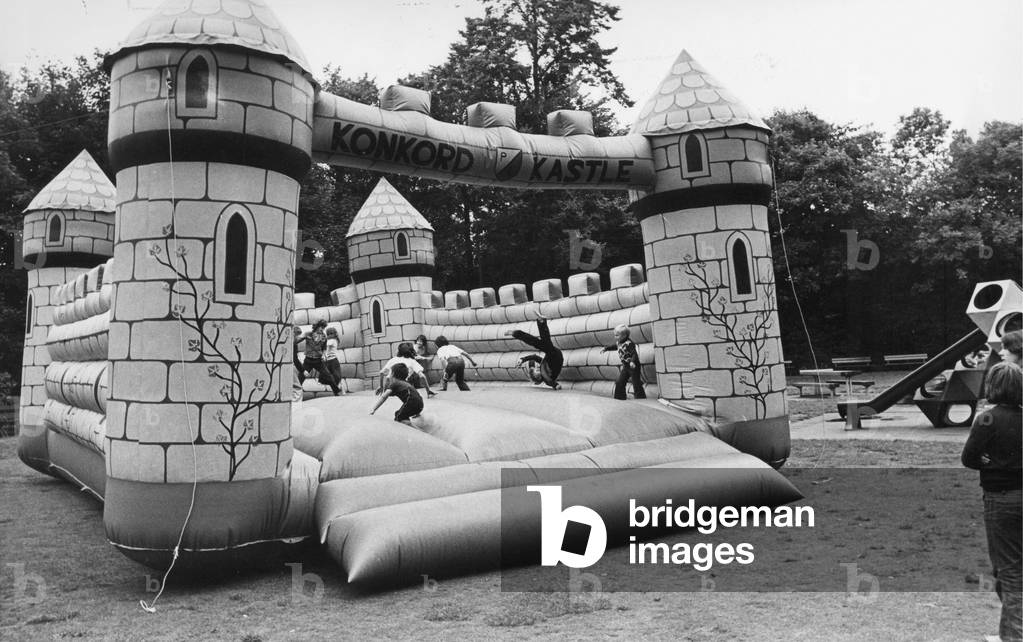 Children enjoy a bouncy castle
