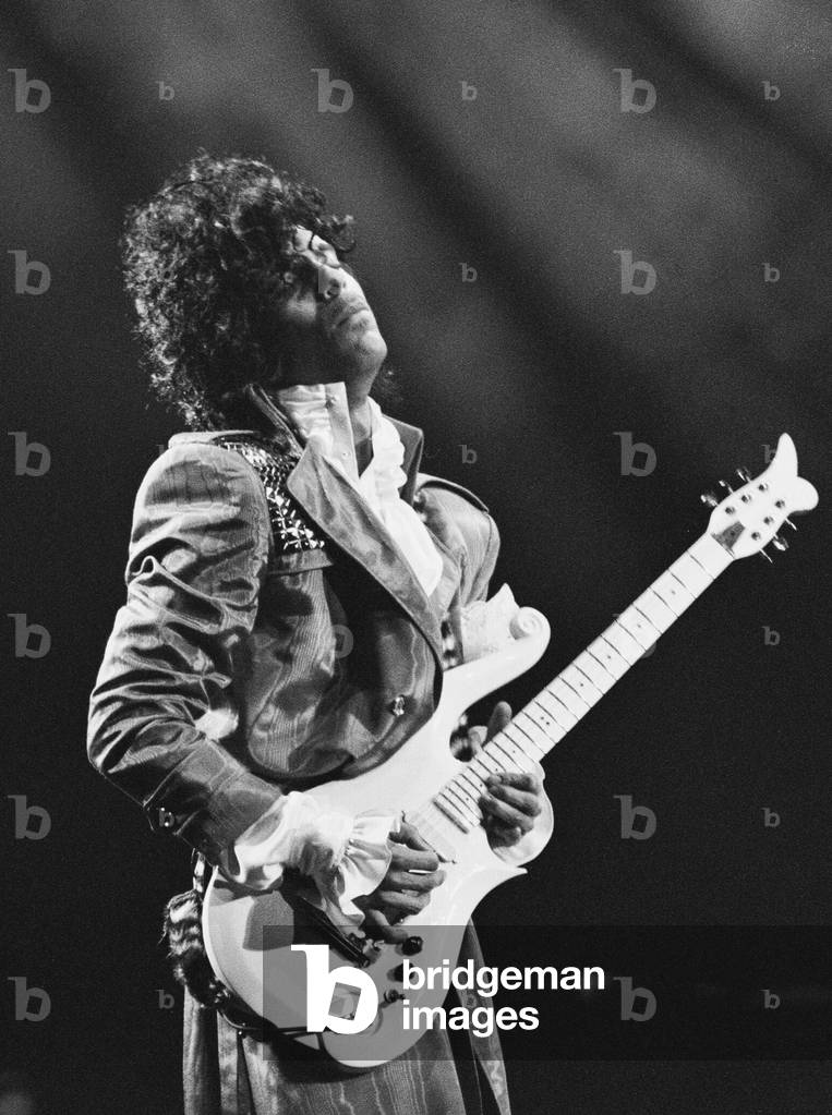 Prince performing on stage at the Joe Louis Arena, Chicago 11th November 1984. The Purple Rain Tour