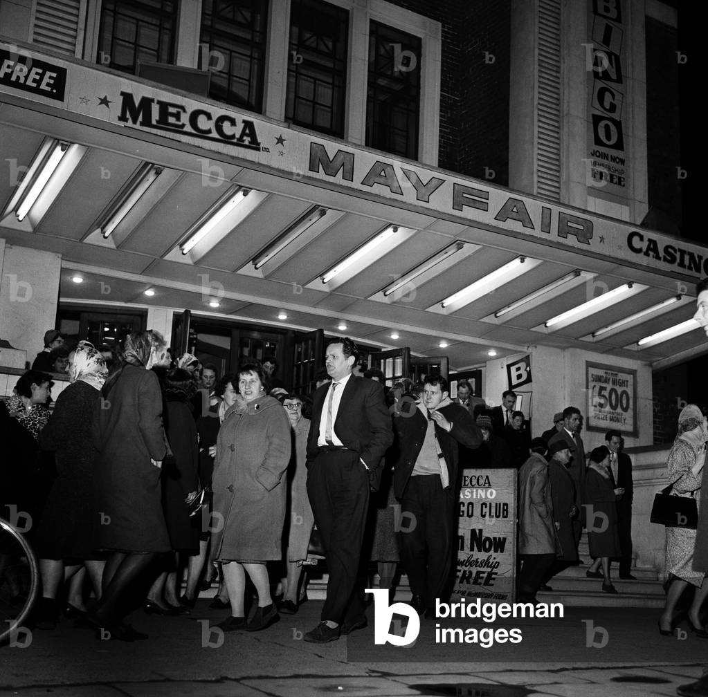 People pour out of Mayfair Bingo Hall in Beverley Road, Hull, East Yorkshire. 16th March 1963 (b/w photo)