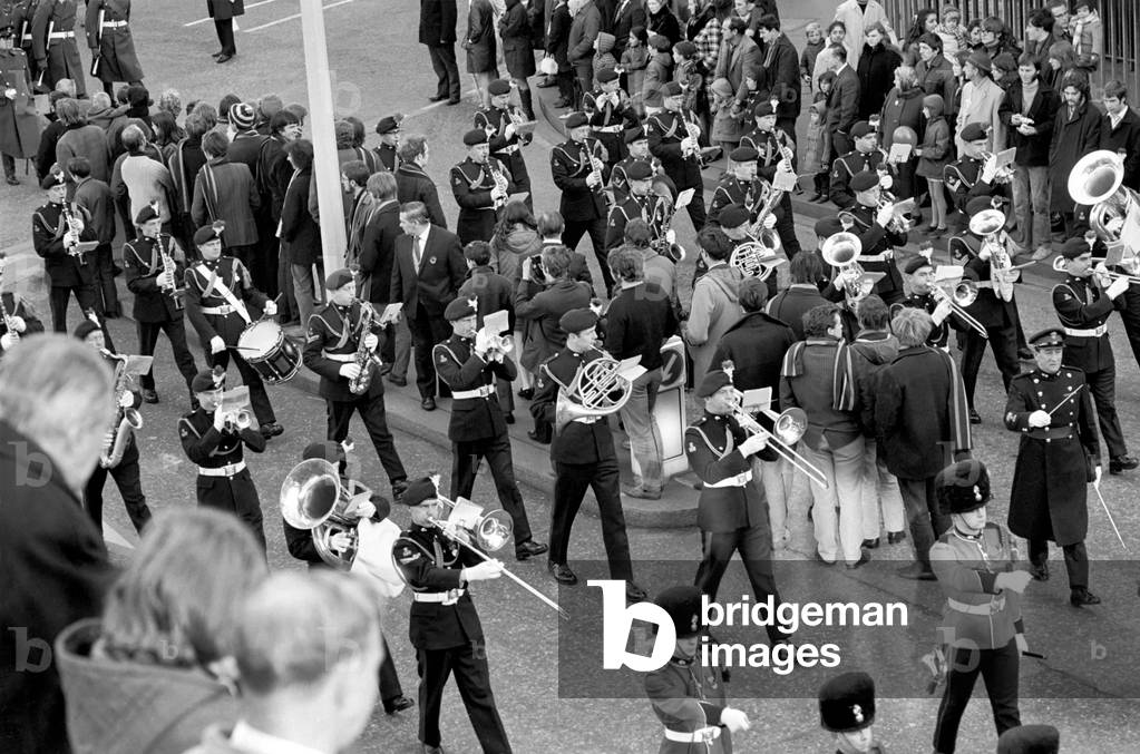 A military band performing, walking through the streets as they take part in the Lord Mayor's show.