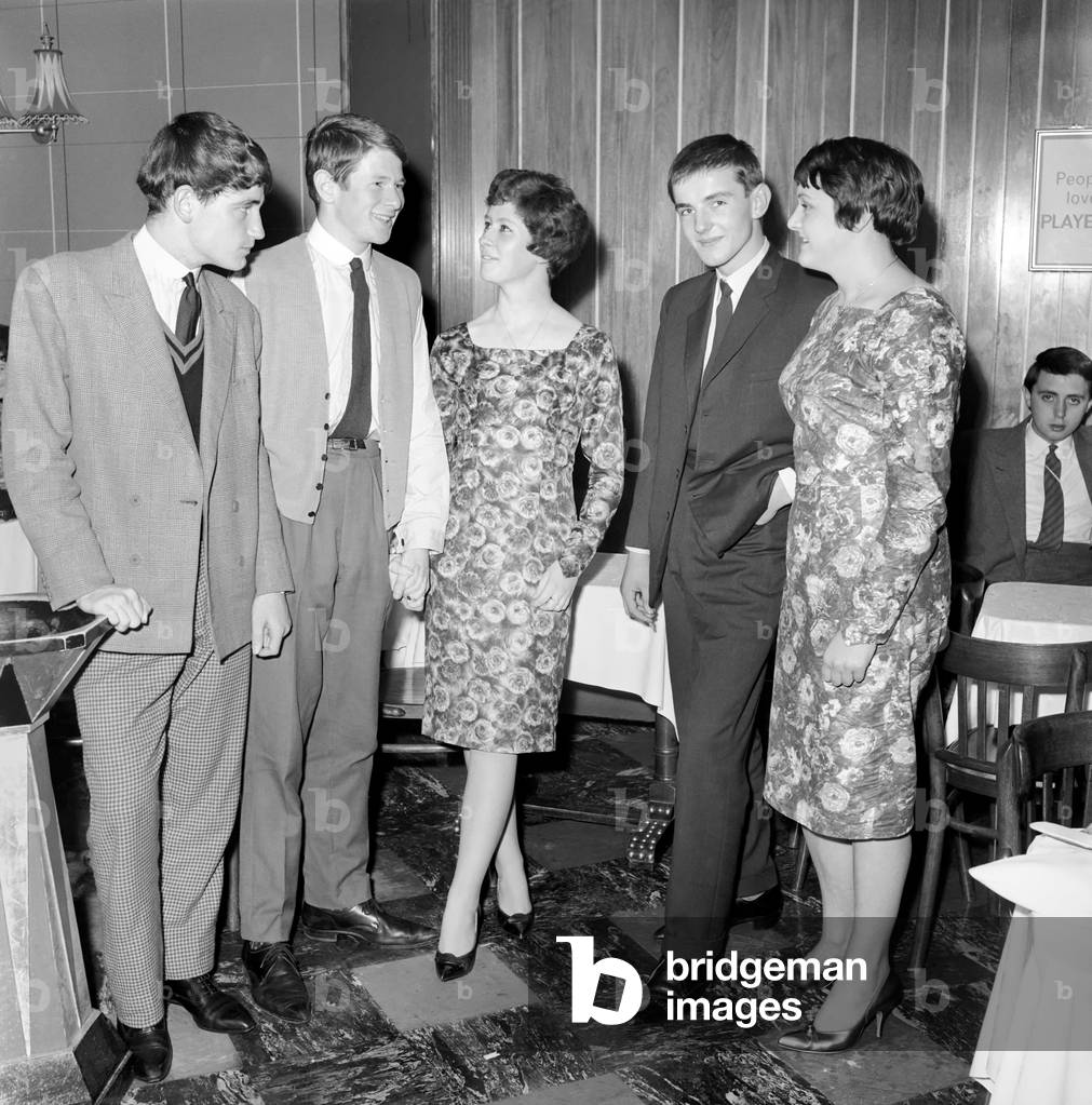 Teenager Fashions: Male Grooming: The teenage boys who go to the Ilford Palais have had to change their style of dress since the introduction of a formal dress code. October 1960 (b/w photo)