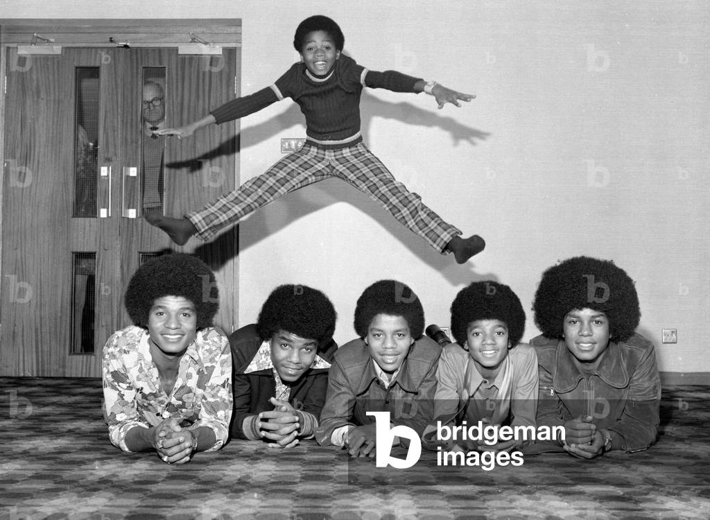 Members of the Jackson Five pop group become the Jackson Six when the latest addition to the family Randy Jackson joined the group. The group pictured left to right are: Jackie, Tito, Marlon, Michael, Jermaine and little Randy jumping above all the lads
November 1972