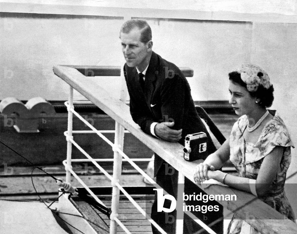 Queen Elizabeth II and her husband Prince Philip, Duke of Edinburgh, on the bridge of the liner Gothic as it arrves at the Miraflores Locks in the Panama Canal during the Royal Tour of the Commonwealth. 30th November 1953 (b/w photo)