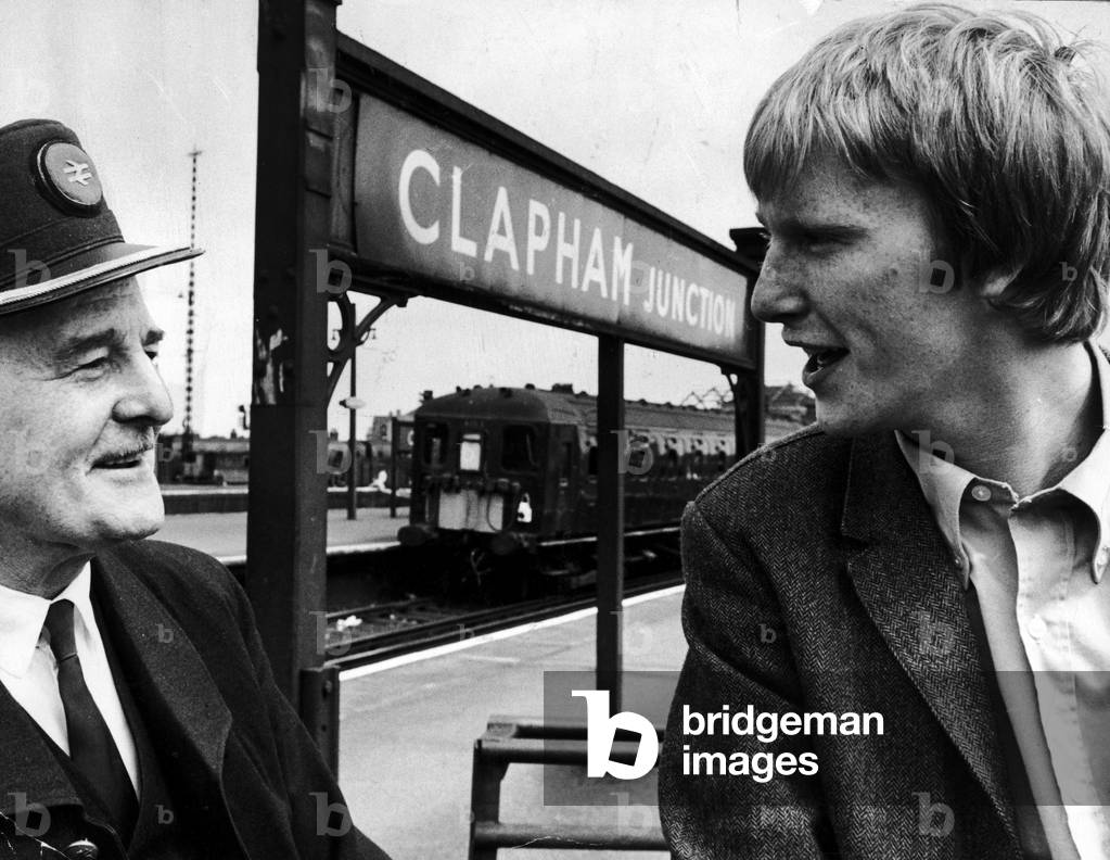 Dennis Waterman and his father Harry Frank Waterman who works as a ticket collector, meet at Clapham Junction. 30/12/1967 (b/w photo)