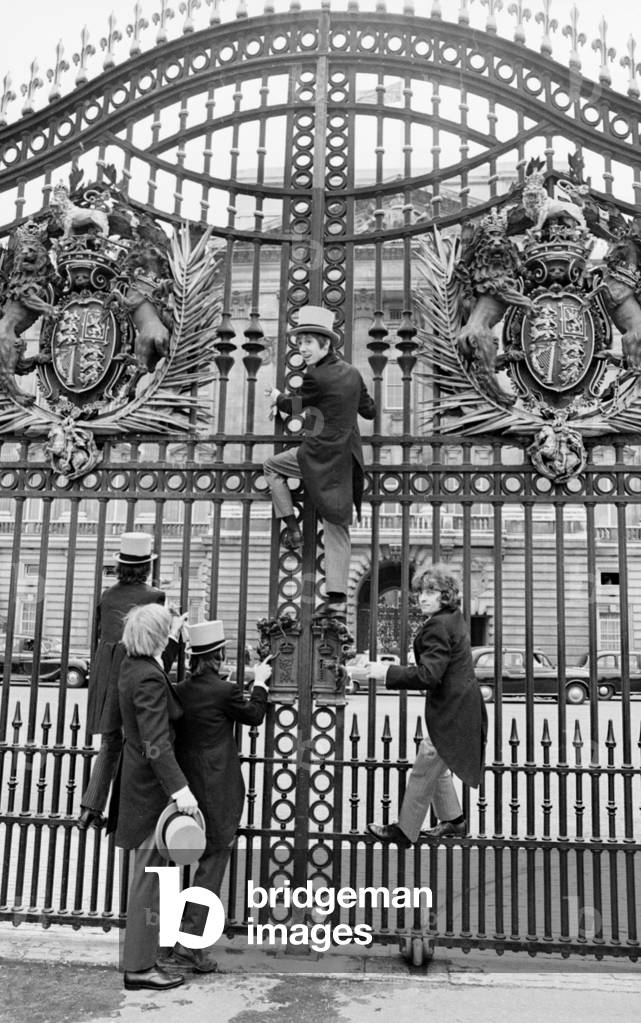 Pop group 'The Easy Beats' outside Buckingham Palace after being refused entry to a garden party. l-r Dick Diamond, Tony Cahil, Harry Vanda, Steve Wright and George Young. 11th July 1968 (b/w photo)