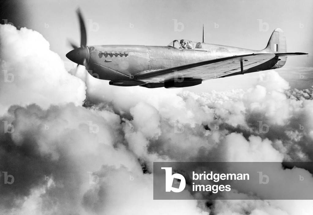Spitfire PR Mark XI, being flown by Jeffrey Quill on a test flight, 13th July 1944 (b/w photo)