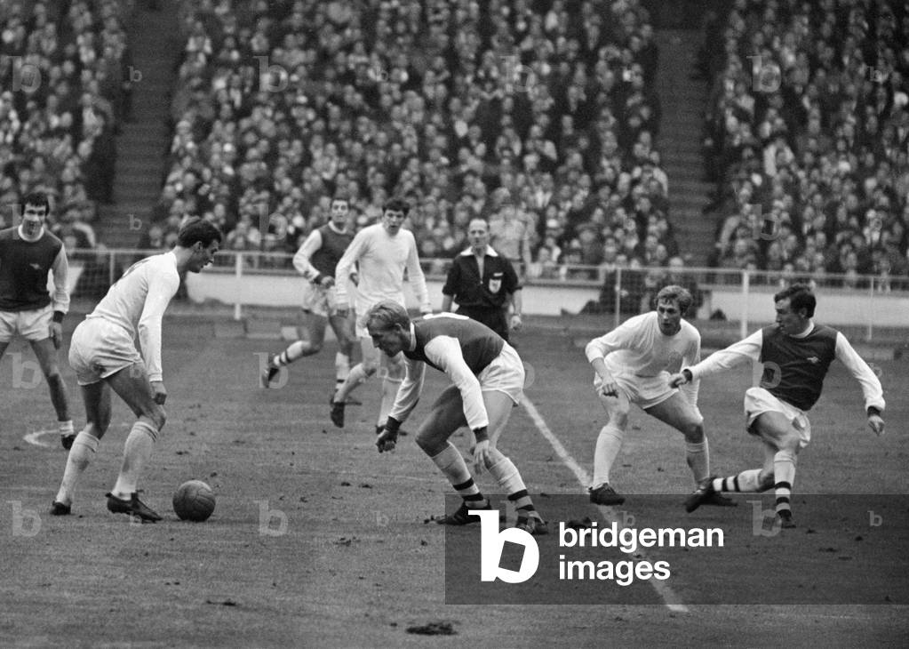 League Cup Final 1968. Arsenal v. Leeds. Paul Madeley with ball at hi feet about to take on Arsenal's Ian Ure. March 5th 1968 (photo)