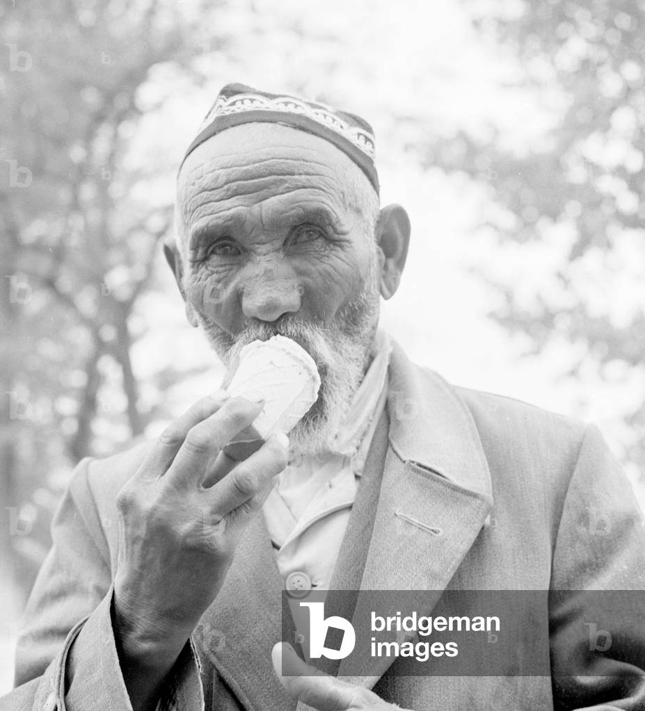 A Moscow resident enjoys an ice cream April 1960
