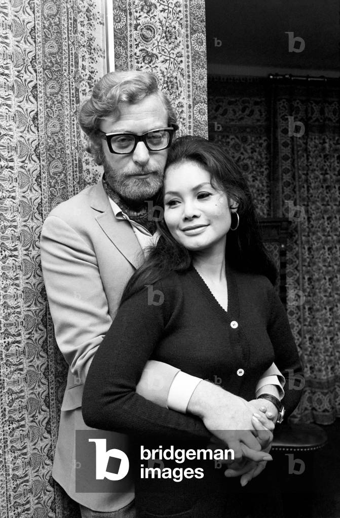 Actor Michael Caine pictured at his home in Grosvenor Square, also pictured is girlfriend Minda Feliciano from the Philippines. November 1969 Z11244-004