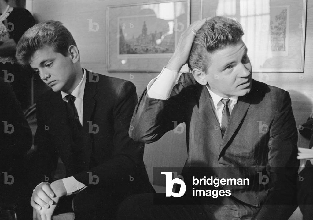 Phil (left) and Don Everly, American singing duo The Everly Brothers, pictured in their suite at the Hilton Hotel in London. 13th September 1963 (b/w photo)