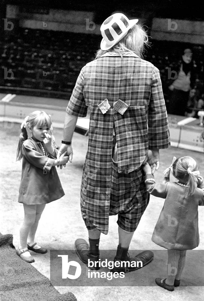 Its great being circus kids for Carol aged 4 and Grace aged 2 daughters of clown Carlos McManus from Plymouth, 15th December 1969 (b/w photo)