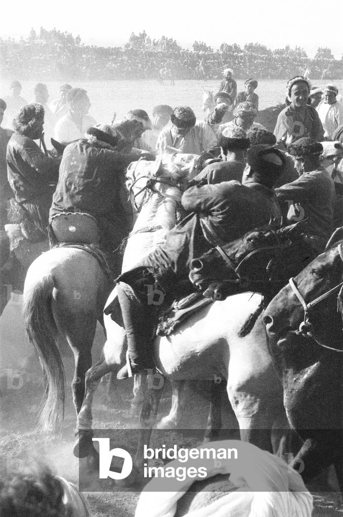A game of Buzkashi in the Afghan town of Mazar e Sharif. Buzkashi (literally 