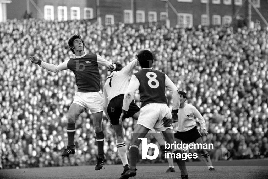 English League Division One match at HighburyArsenal 4 v Derby County 0. Charlie George jumps up for a high ballNovember 1969 (photo)