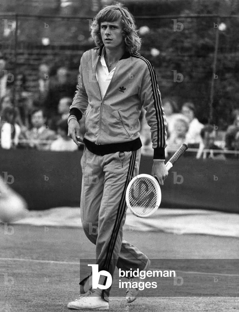 Swedish star Bjorn Borg played in a doubles match wearing this bright red track suit. June 1974