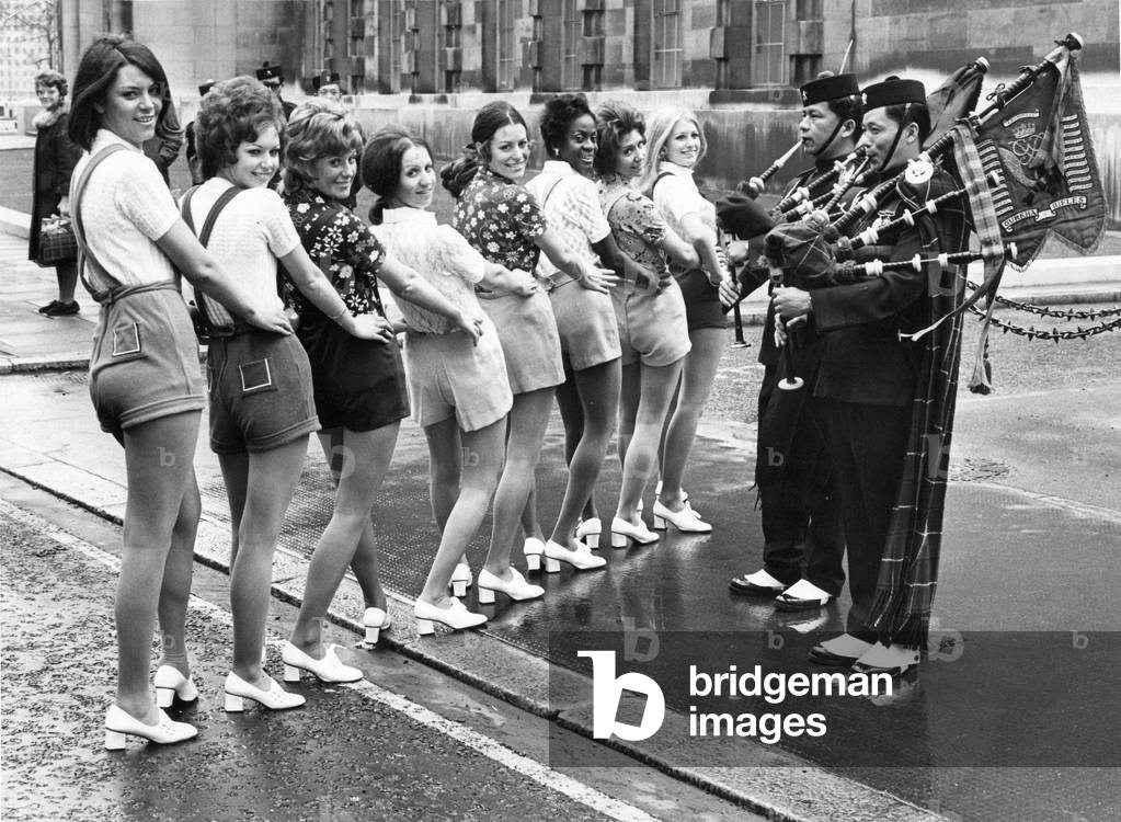 On parade in hot pants to the pipes of the Gurkha rifles. Marks and spencer salesgirls model hot pants