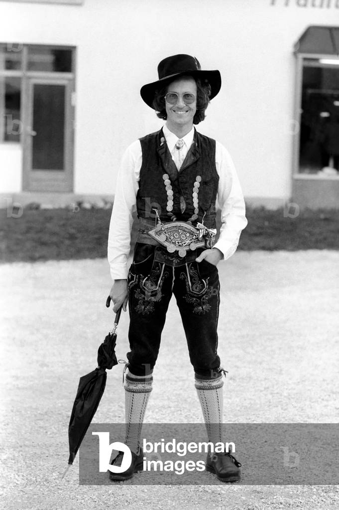 Chris Ward wearing Lederhosen in the village of Ruhpolding, near Munich, May 1975 (b/w photo)