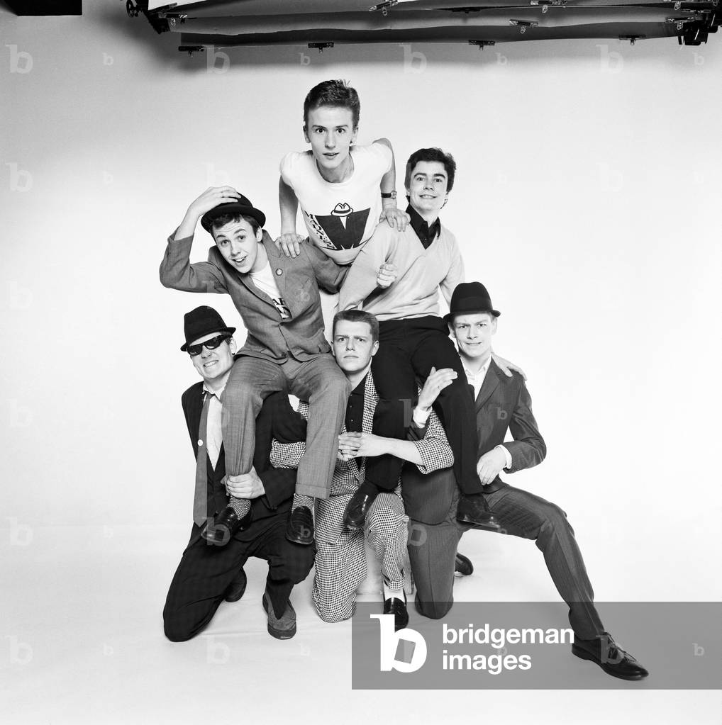 Pop group Madness pose in the Daily Mirror Studio, minus member Lee Thompson. 11th February 1980 (b/w photo)