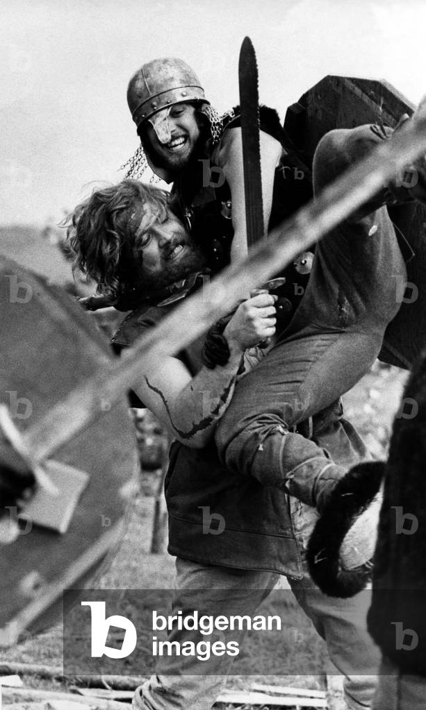 Viking v Anglo Saxon - An unusual way to spend your weekend but the smile on the face of the Viking warrior shows he's enjoying himself at the Viking battle re-enactment at South Shields, on 26th August 1973 (b/w photo)